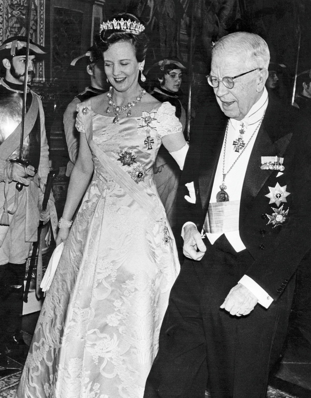 Queen Margrethe II of Denmark attends a state banquet hosted by her grandfather, King Gustaf VI Adolf of Sweden, at the Royal Palace in Stockholm in 1973 (Classic Picture Library/Alamy)