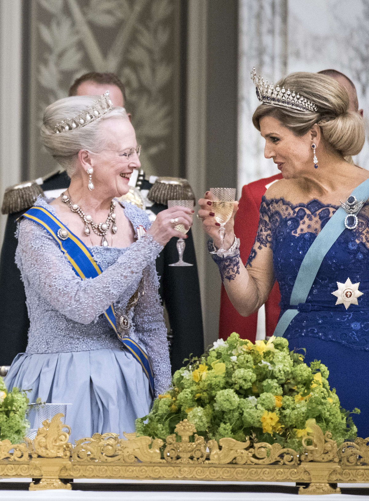 Queen Margrethe II of Denmark and Queen Maxima of the Netherlands share a toast during a state banquet at Christiansborg Palace in Copenhagen on March 17, 2015 (Niels Ahlmann Olesen/AFP/Getty Images)
