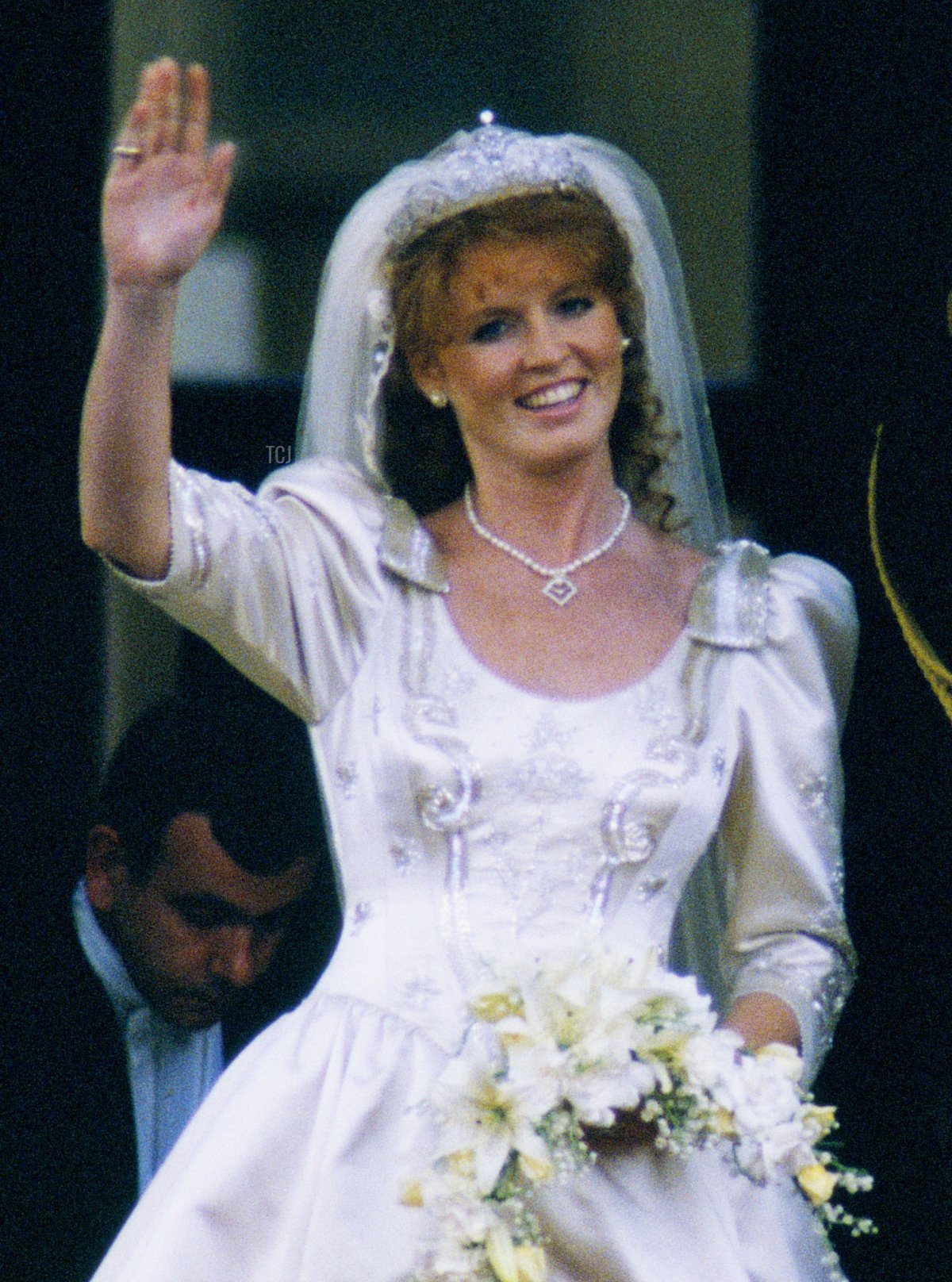 The Duchess of York waves from the balcony of Buckingham Palace after her royal wedding, July 1986 (Peter Jordan/Alamy)
