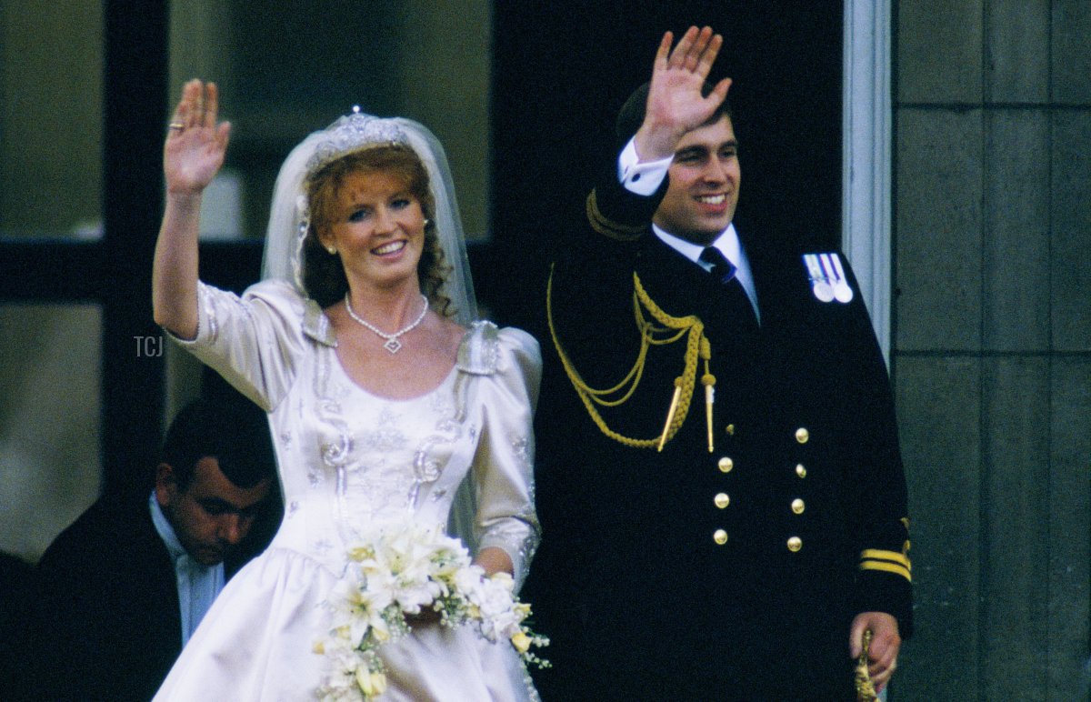 The Duke and Duchess of York wave from the balcony of Buckingham Palace after their royal wedding, July 1986 (Peter Jordan/Alamy)