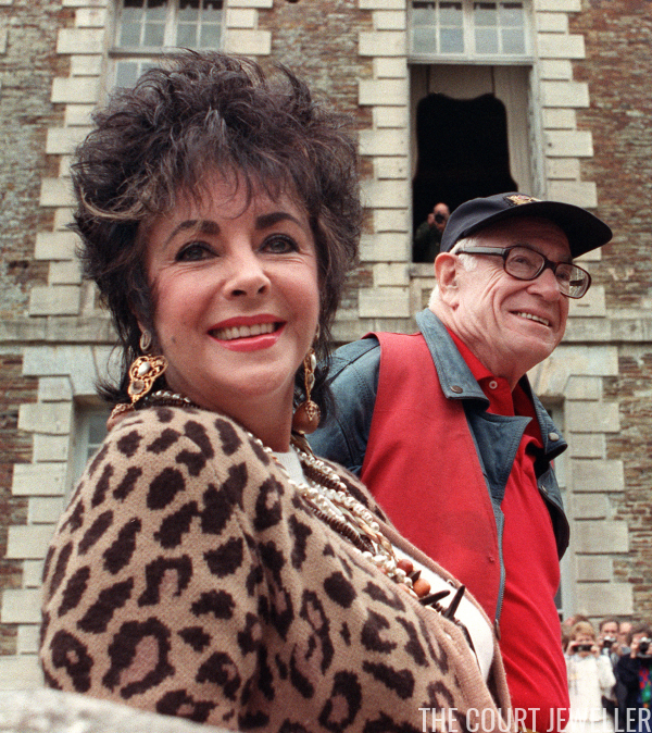 Malcolm Forbes and close friend Elizabeth Taylor at the Château de Balleroy in Normandy, 11 June 1988 (MYCHELE DANIAU/AFP/Getty Images)