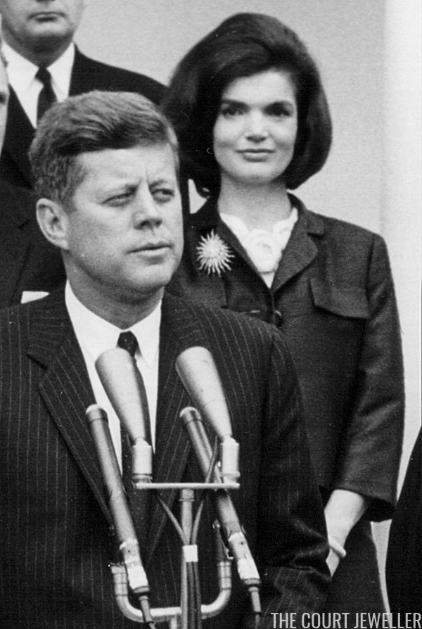 Kennedy wears the brooch during a White House press conference, 9 April 1962 (National Archive/Newsmakers)
