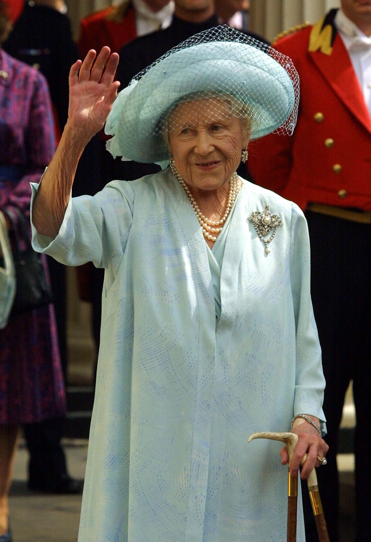 The Queen Mother waves to a crowd outside Clarence House in London on her 101st birthday, August 4, 2001 (Sion Touhig/Getty Images)