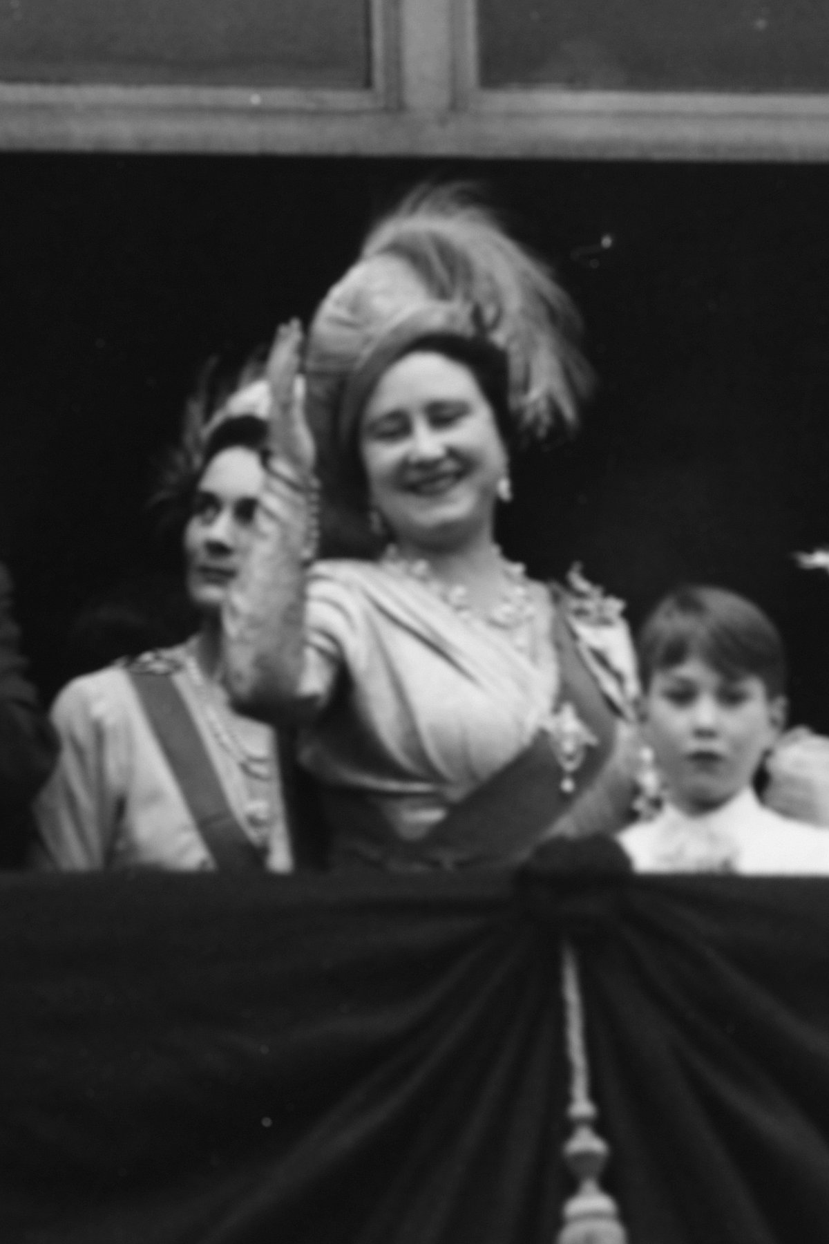 Queen Elizabeth waves from the balcony of Buckingham Palace after the wedding of Princess Elizabeth and Lt. Philip Mountbatten, November 20, 1947 (Hulton Archive/Getty Images)