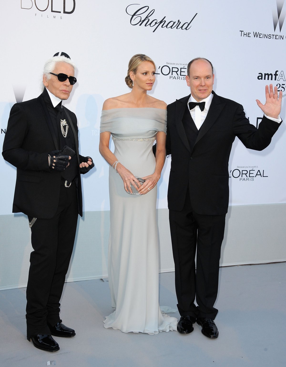 Karl Lagerfeld, Charlene Wittstock and Prince Albert II of Monaco attend amfAR's Cinema Against AIDS Gala during the 64th Annual Cannes Film Festival at Hotel Du Cap on May 19, 2011 in Antibes