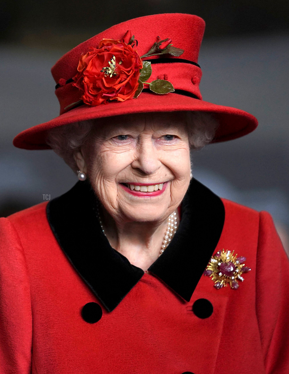 Queen Elizabeth II reacts as she meets military personnel during her visit to the aircraft carrier HMS Queen Elizabeth in Portsmouth, southern England on May 22, 2021