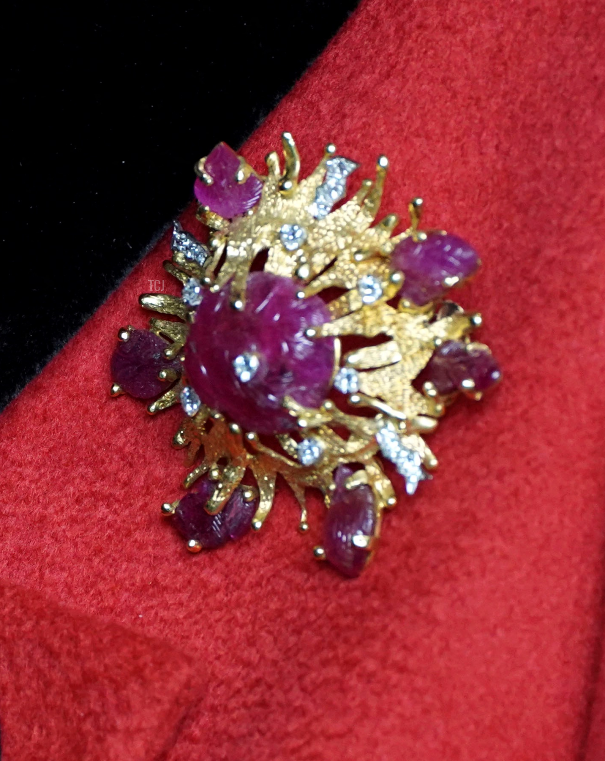 Queen Elizabeth II reacts as she meets military personnel during her visit to the aircraft carrier HMS Queen Elizabeth in Portsmouth, southern England on May 22, 2021