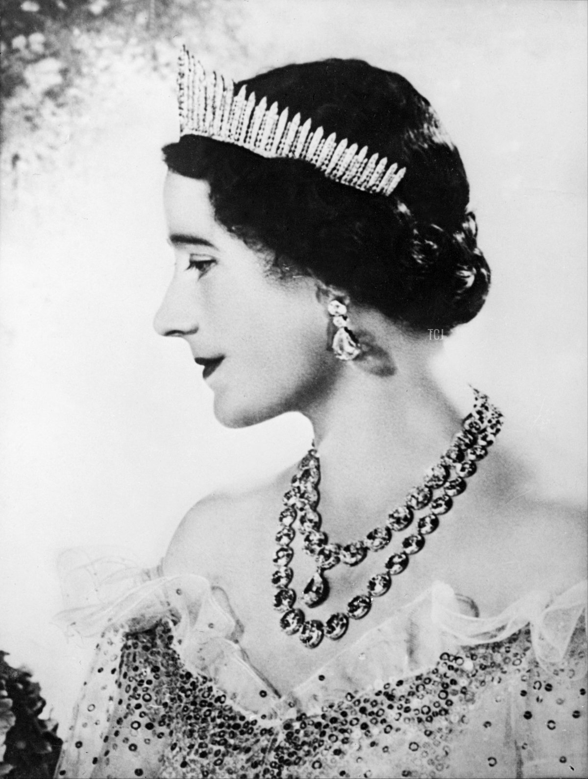 Queen Elizabeth, the former Duchess of York smiles as she poses in 1937 for official picture in London after the Coronation 12 May 1937 of the Duke of York