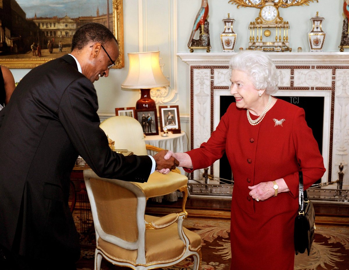 Queen Elizabeth II shakes hands with Rwanda's President Paul Kagame after he arrived at Buckingham Palace for a private audience on March 8, 2010 in London, England