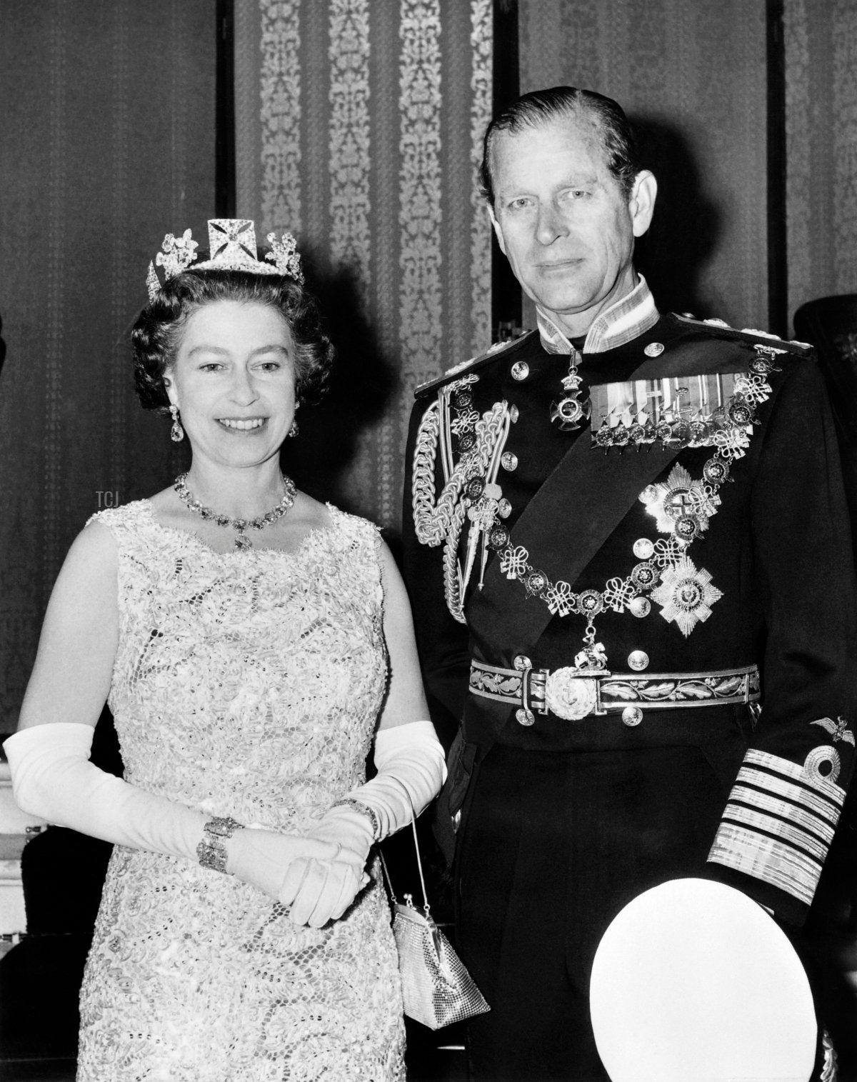 Official photo taken on November 3, 1972 shows Britain's Queen Elizabeth II, wearing the George IV State Diadem, diamond tiara on British and Commonwealth stamps, and Prince Philip, Duke of Edinburgh, on the occasion of their 25th wedding anniversary
