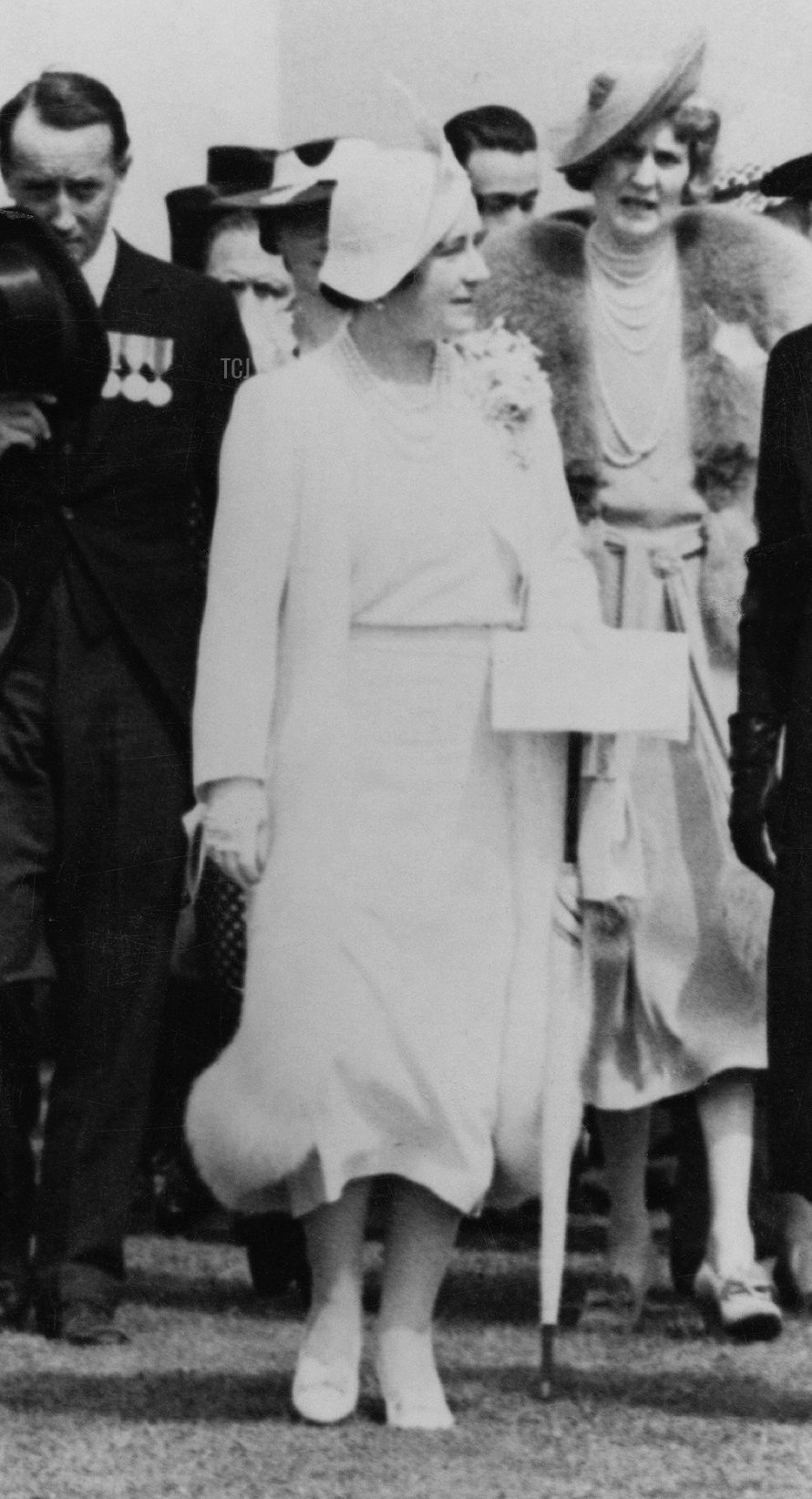 King George VI (1895 - 1952) and Queen Elizabeth (1900 - 2002) unveil the VillersBretonneux Australian National Memorial in the Somme, during their State Visit to France, 22nd July 1938. The Queen is wearing a dress from the White Wardrobe designed for her by Norman Hartnell to mark the death of her mother, the Countess of Strathmore