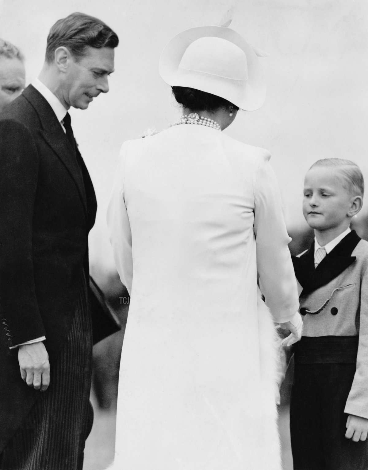 King George VI (1895 - 1952) and Queen Elizabeth (1900 - 2002) unveil the VillersBretonneux Australian National Memorial in the Somme, during their State Visit to France, 22nd July 1938. The Queen is wearing a dress from the White Wardrobe designed for her by Norman Hartnell to mark the death of her mother, the Countess of Strathmore