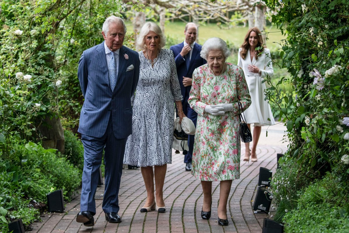 Britain's Prince Charles, Prince of Wales (L), Britain's Camilla, Duchess of Cornwall (C) and Britain's Queen Elizabeth II (R) attend a reception with G7 leaders at The Eden Project in south west England on June 11, 2021. - G7 leaders from Canada, France, Germany, Italy, Japan, the UK and the United States meet this weekend for the first time in nearly two years, for three-day talks in Carbis Bay, Cornwall