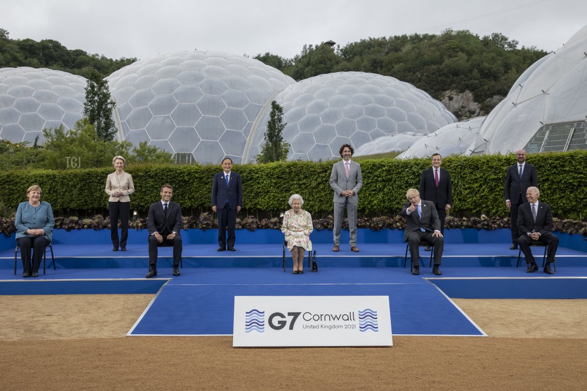 German Chancellor Angela Merkel, European Commission Ursula von der Leyen, French President Emmanuel Macron, Japanese Prime Minister Yoshihide Suga, Queen Elizabeth II, Canadian Prime Minister Justin Trudeau, British Prime Minister Boris Johnson, Italian Prime Minister Mario Draghi, President of the European Council Charles Michel and United States President Joe Biden pose for a group photo at a drinks reception for Queen Elizabeth II and G7 leaders at The Eden Project during the G7 Summit on June 11, 2021 in St Austell, Cornwall, England