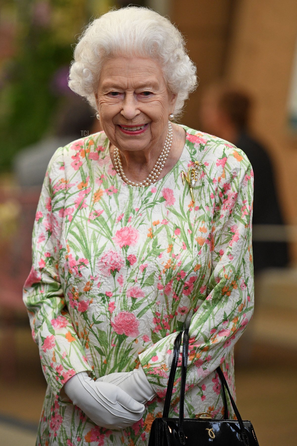 Britain's Queen Elizabeth II smiles as she meets people from communities across Cornwall during an event in celebration of The Big Lunch initiative at The Eden Project, near St Austell in south west England on June 11, 2021