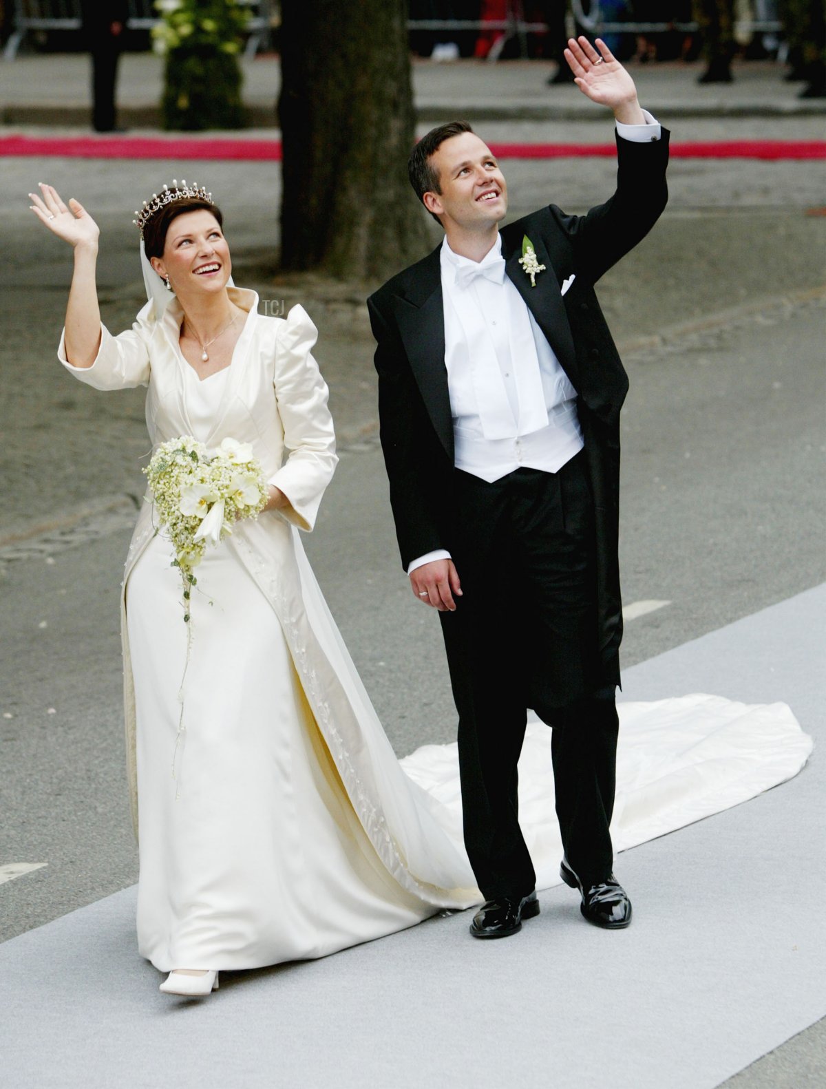 Norwegian Princess Martha Louise and Ari Behn wave at the crowd after they were married May 24, 2002 in Trondheim, Norway