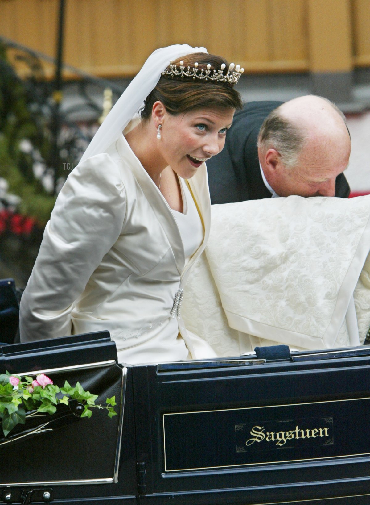 Norwegian Princess Martha Louise is helped into a carriage by her father King Harald V on their way to her wedding to writer Ari Behn May 24, 2002 in Trondheim, Norway