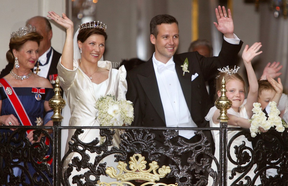 Princess Martha Louise of Norway and writer Ari Behn wave from the balcony of the Stiftsgarden Palace after their wedding at the Nidaros Cathedral May 24, 2002 in Trondheim, Norway