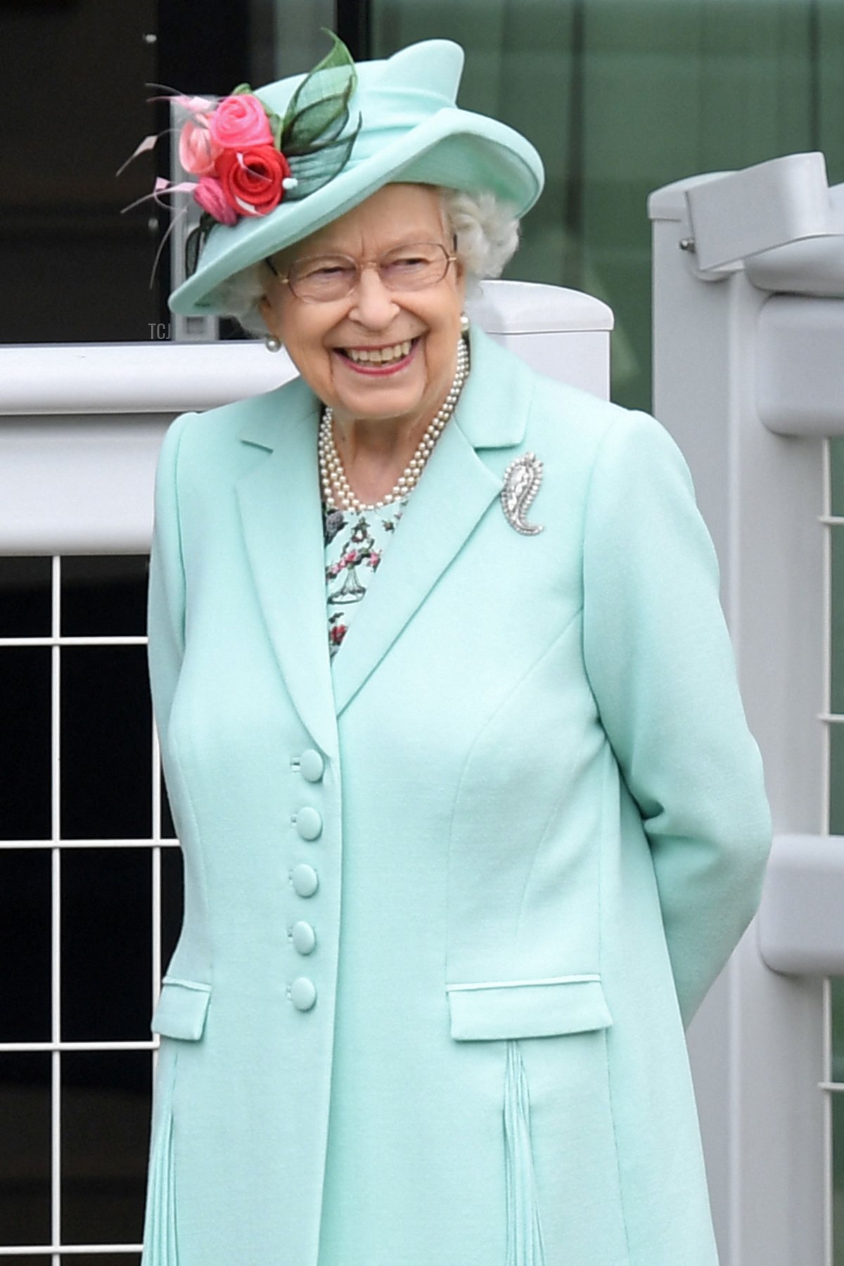 Britain's Queen Elizabeth II smiles as she attends the fifth day of the Royal Ascot horse racing meet, in Ascot, west of London on June 19, 2021