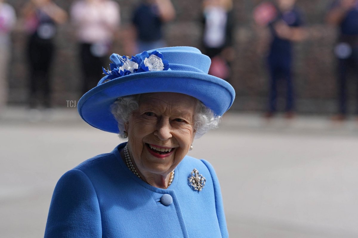 Britain's Queen Elizabeth II smiles as she visits AG Barr's factory in Cumbernauld, east of Glasgow, where the Irn-Bru drink is manufactured on June 28, 2021