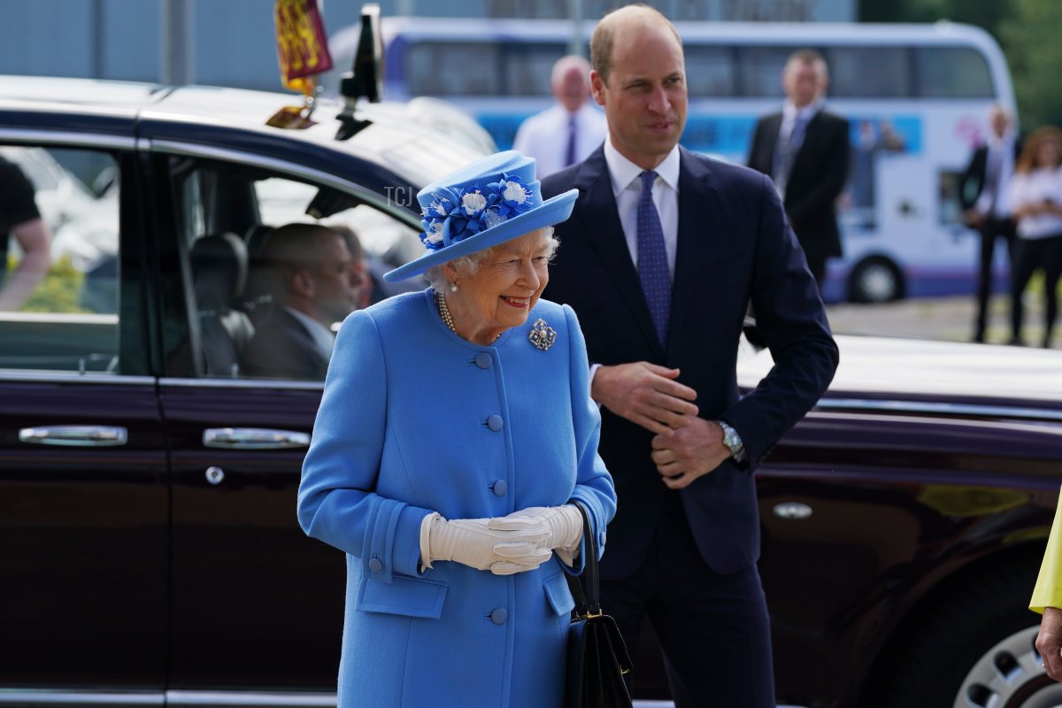 Queen Elizabeth II and Prince William, Duke of Cambridge, known as the Earl of Strathearn in Scotland, arrive for a visit to AG Barr's factory in Cumbernauld, where the Irn-Bru drink is manufactured, as part of her traditional trip to Scotland for Holyrood Week on June 28, 2021 in Cumbernauld, Scotland
