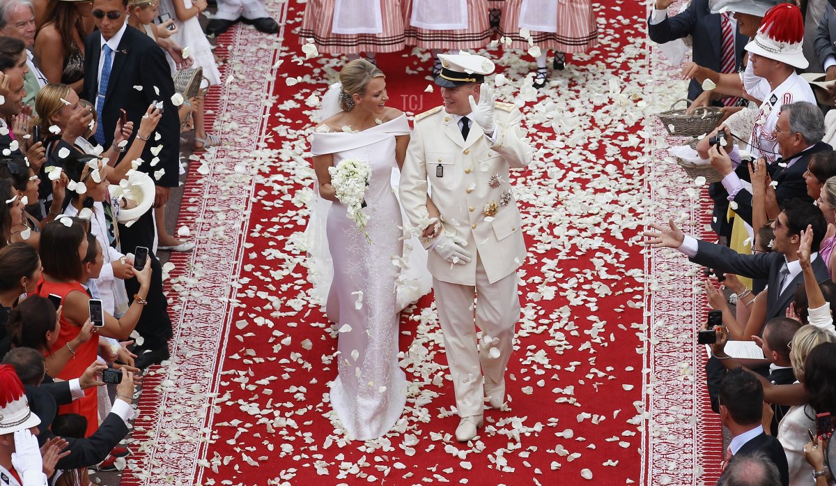 Princess Charlene of Monaco and Prince Albert Of Monaco smile as they leave the palace after the religious ceremony of the Royal Wedding of Prince Albert II of Monaco to Charlene Wittstock in the main courtyard at Prince's Palace on July 2, 2011 in Monaco