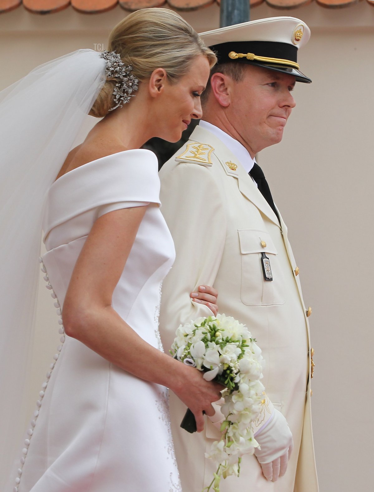 Princess Charlene of Monaco and Prince Albert II of Monaco leave the Prince's Palace after the religious ceremony of their Royal Wedding on July 2, 2011 in Monaco