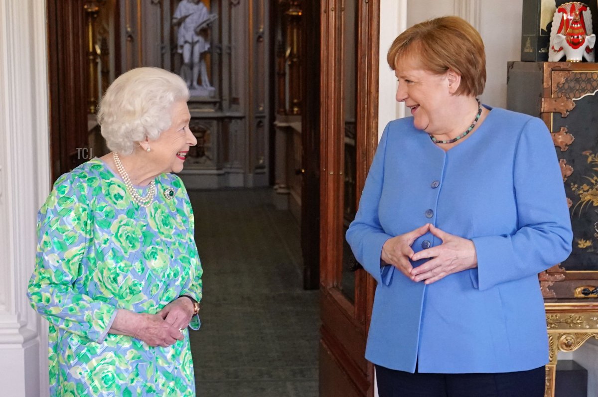 Britain's Queen Elizabeth II receives German Chancellor Angela Merkel during an audience at Windsor Castle in Windsor, Berkshire on July 2, 2021. - German leader Angela Merkel will have a new a science prize established in her honour during a farewell visit to Britain on Friday, which will also include a meeting with Queen Elizabeth II