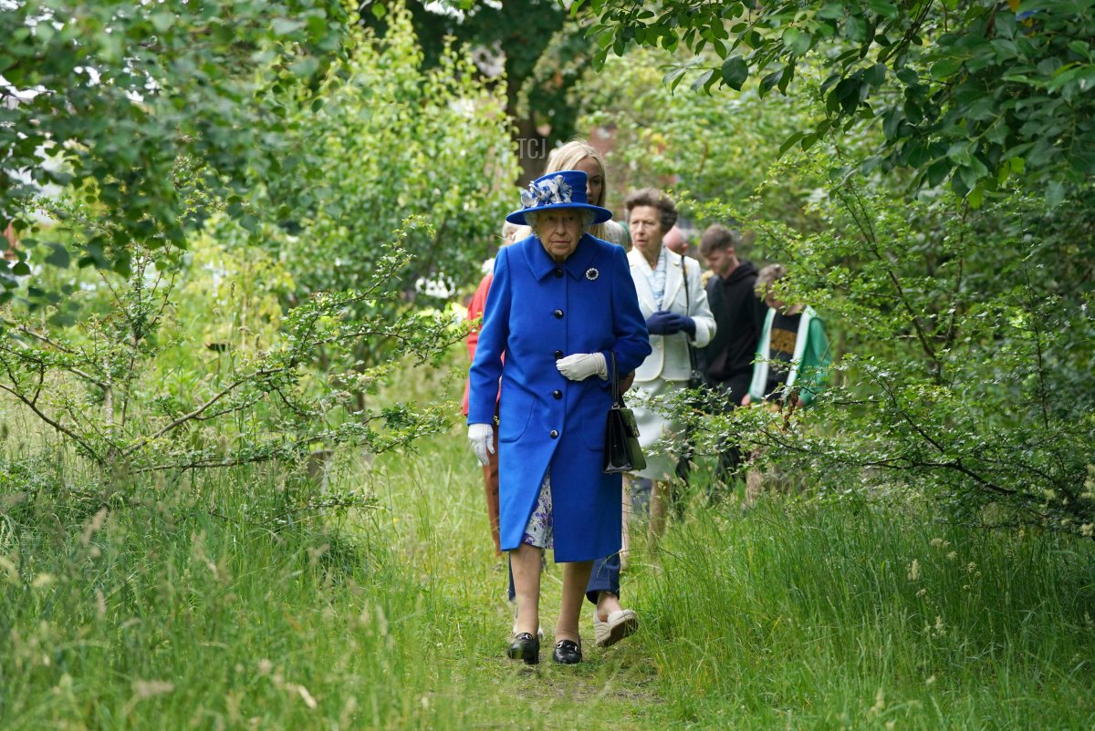 Britain's Queen Elizabeth II takes a walk during a visit to The Childrens Wood Project in Glasgow on June 30, 2021, as part of her traditional trip to Scotland for Holyrood Week