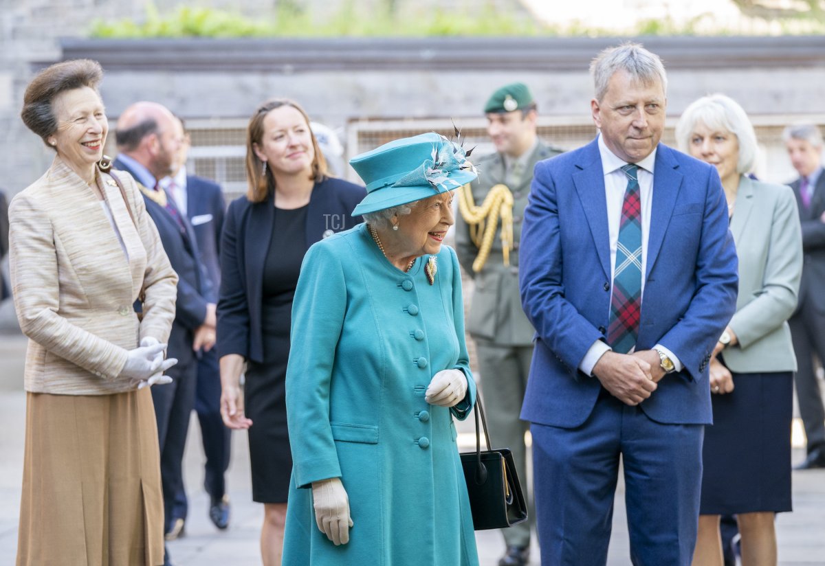 Queen Elizabeth II and The Princess Royal with Principal and Vice-Chancellor Peter Mathieson (R), during a visit to the Edinburgh Climate Change Institute, as part of her traditional trip to Scotland for Holyrood Week on July 1, 2021 in Edinburgh, Scotland