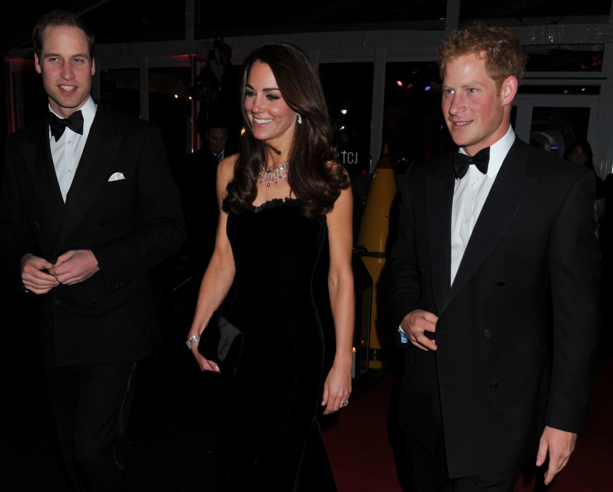 Britain's Prince William and Catherine, Duchess of Cambridge, arrive with Prince Harry to attend "A Night of Heros", the annual Sun Military Awards, to honour members of the British armed forces in London on December 19, 2011