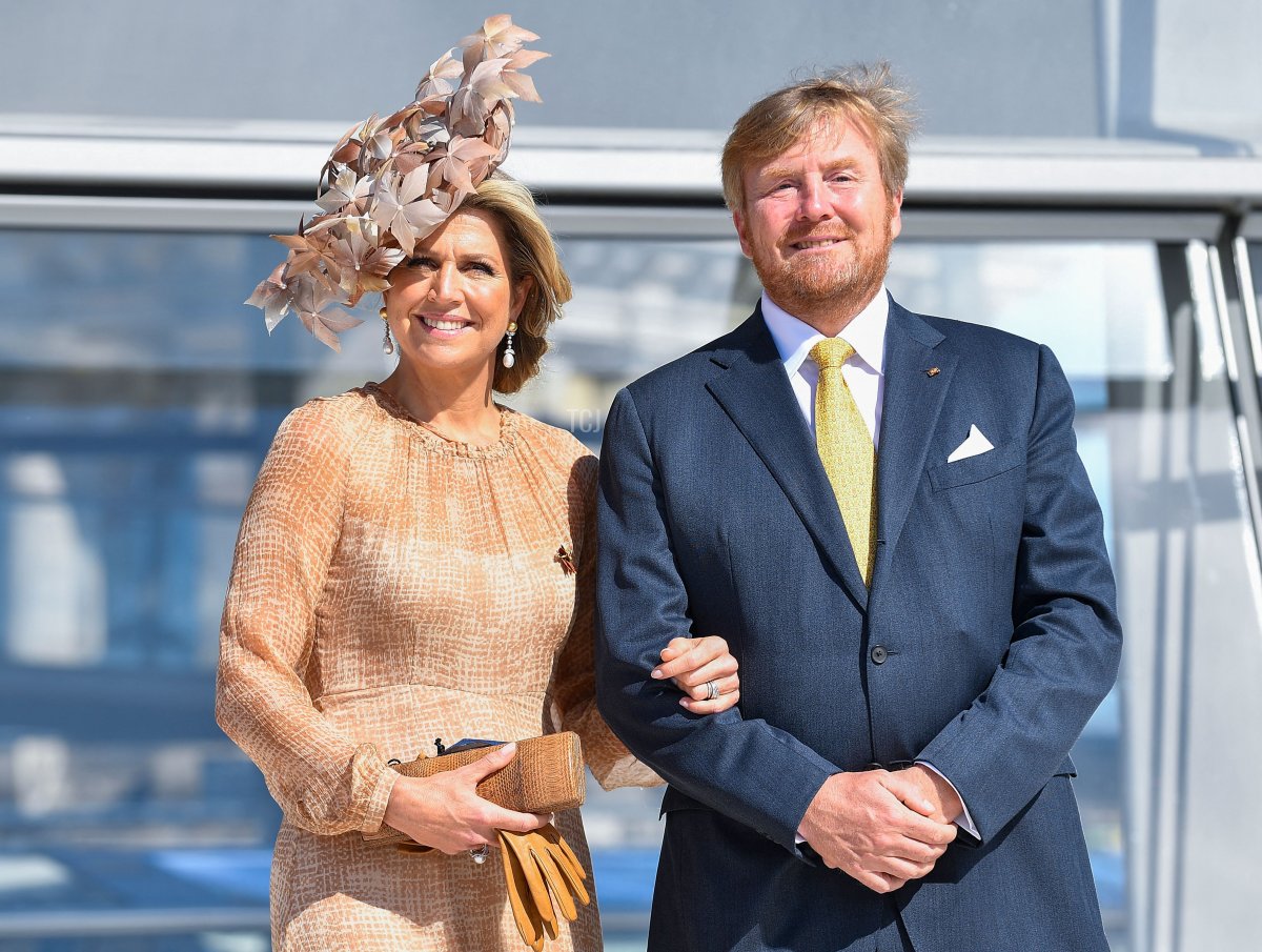 King Willem-Alexander and Queen Maxima of the Netherlands pose outside the cupola of the Reichstag building, housing the Bundestag, the lower house of parliament, in Berlin on July 6, 2021