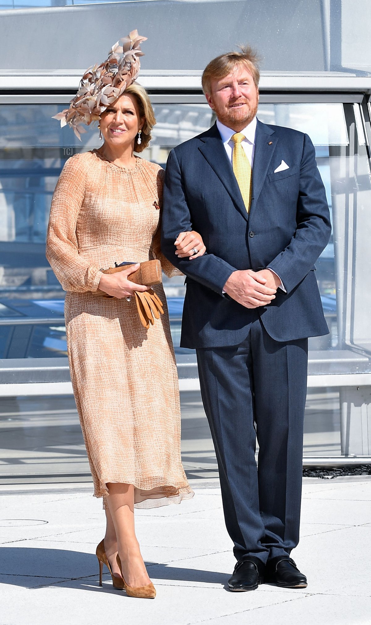 King Willem-Alexander and Queen Maxima of the Netherlands pose outside th cupola of the Reichstag building, housing the Bundestag, the lower house of parliament, in Berlin on July 6, 2021