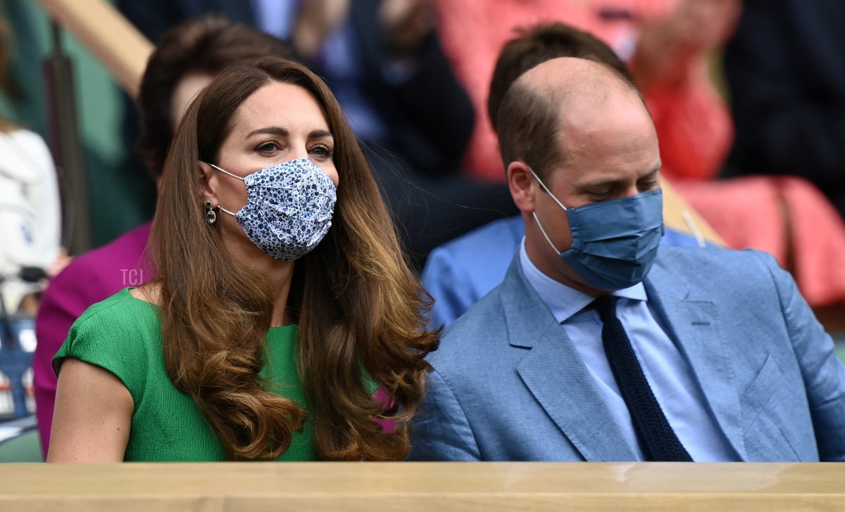 Britain's Catherine, Duchess of Cambridge and Britain's Prince William, Duke of Cambridge, wearing face masks, take their sets in the Royal box to watch the women's singles final on the twelfth day of the 2021 Wimbledon Championships at The All England Tennis Club in Wimbledon, southwest London, on July 10, 2021