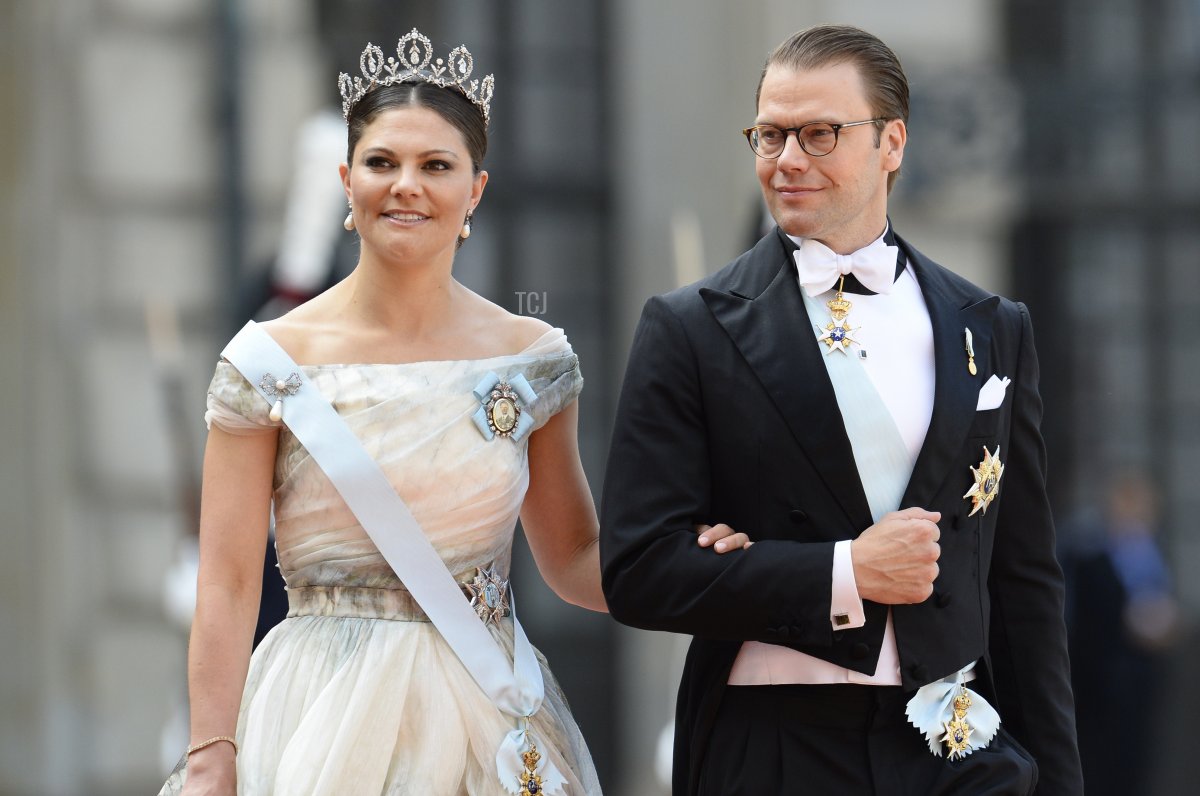 Sweden's Crown Princess Victoria (L) and Sweden's Prince Daniel arrive for the wedding of Sweden's Crown Prince Carl Philip and Sofia Hellqvist at Stockholm Palace on June 13, 2015