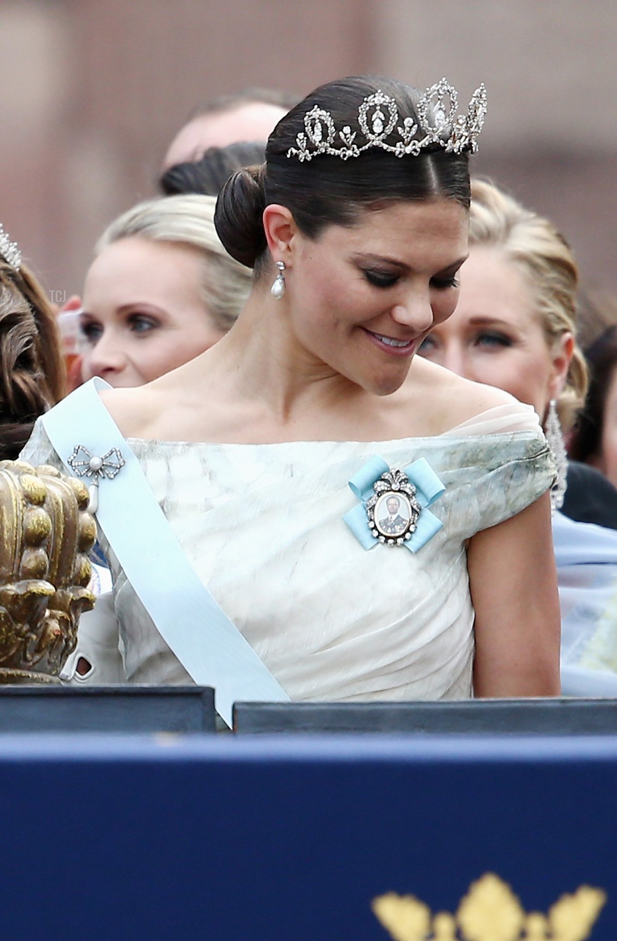 Prince Carl Philip of Sweden places one hand on the crown as he stands next to his sister, Crown Princess Victoria of Sweden, after his marriage ceremony to Princess Sofia, at The Royal Palace on June 13, 2015 in Stockholm, Sweden