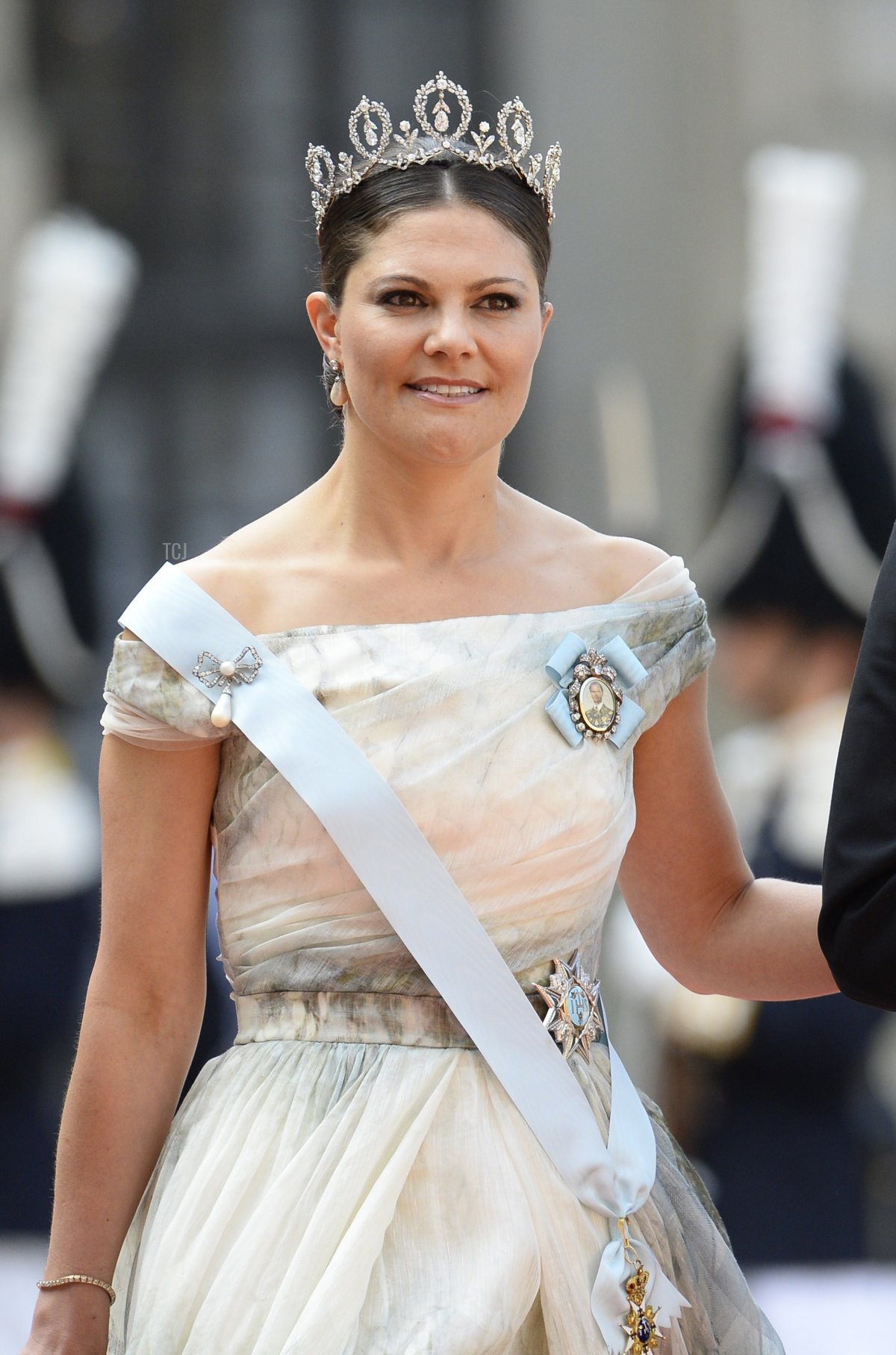 Sweden's Crown Princess Victoria (L) and Sweden's Prince Daniel arrive for the wedding of Sweden's Crown Prince Carl Philip and Sofia Hellqvist at Stockholm Palace on June 13, 2015