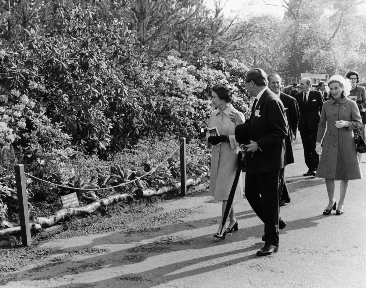 Queen Elizabeth II (left) on a tour of the Chelsea Flower Show, London, 19th May 1975