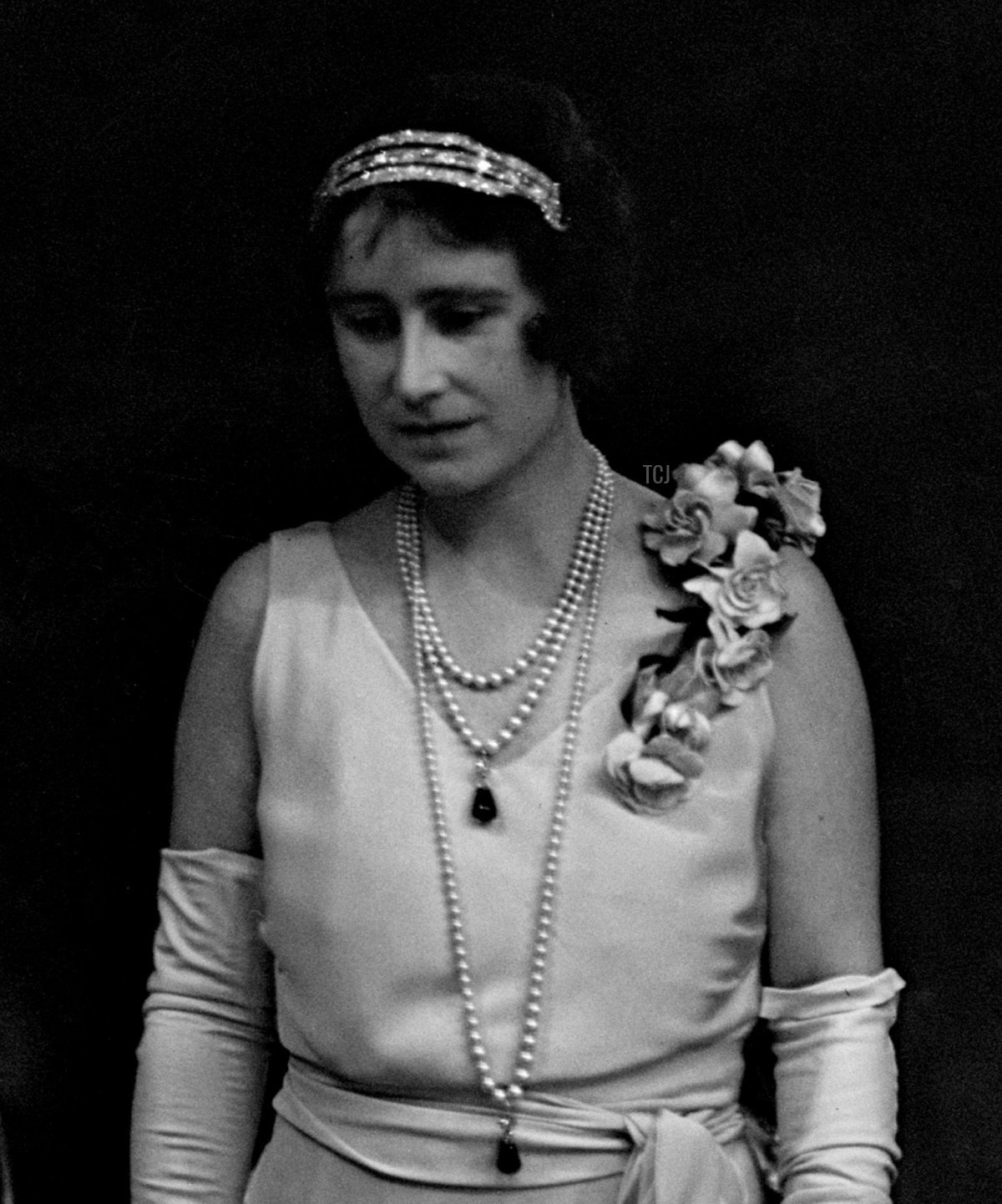 The Duchess of York (later Queen Elizabeth the Queen Mother) wears her Cartier Bracelet Bandeau to attend a ballet performance at the Royal Opera House, July 1933