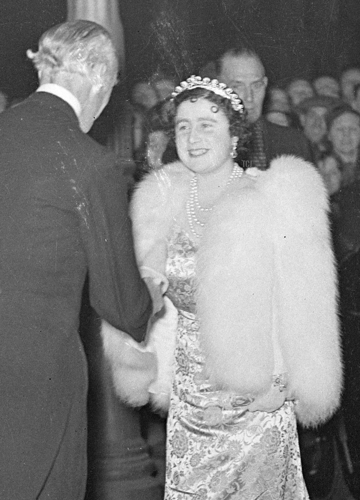Queen Elizabeth of the United Kingdom (later the Queen Mother) wears the Cartier Halo Tiara for a special performance of Macbeth (which is, of course, set at her childhood home of Glamis Castle) at the Old Vic in aid of the Centenary Fund of the Kings College Hospital, November 1937