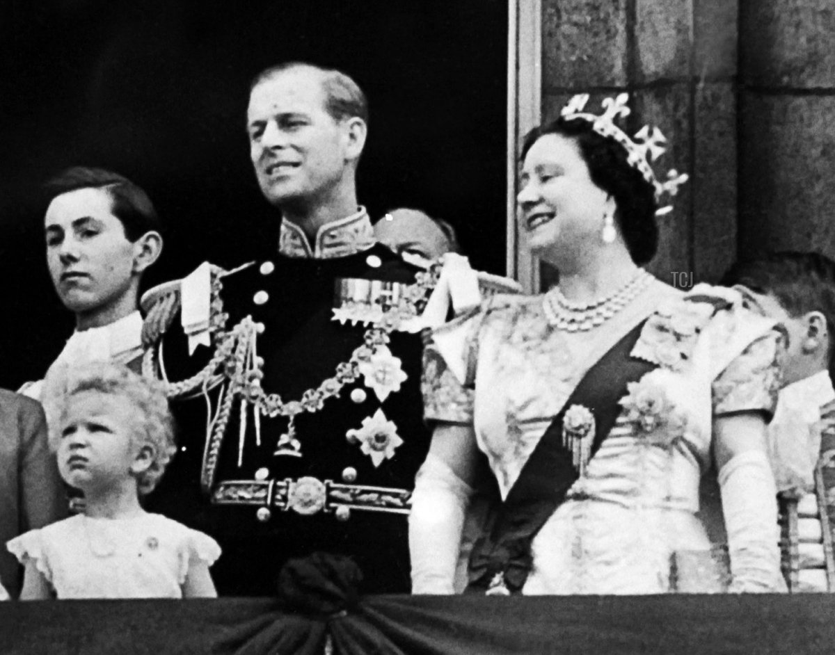 Princess Anne, Prince Philip, and the Queen Mother appear on a balcony of Buckingham Palace, on Coronation day, on June 02, 1953 in London