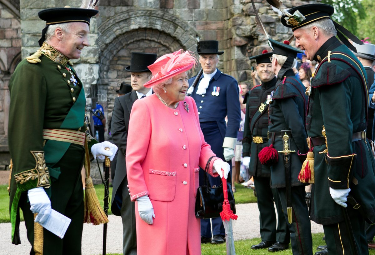 Britain's Queen Elizabeth II attends a garden party at the Palace of Holyroodhouse in Edinburgh on July 3, 2019