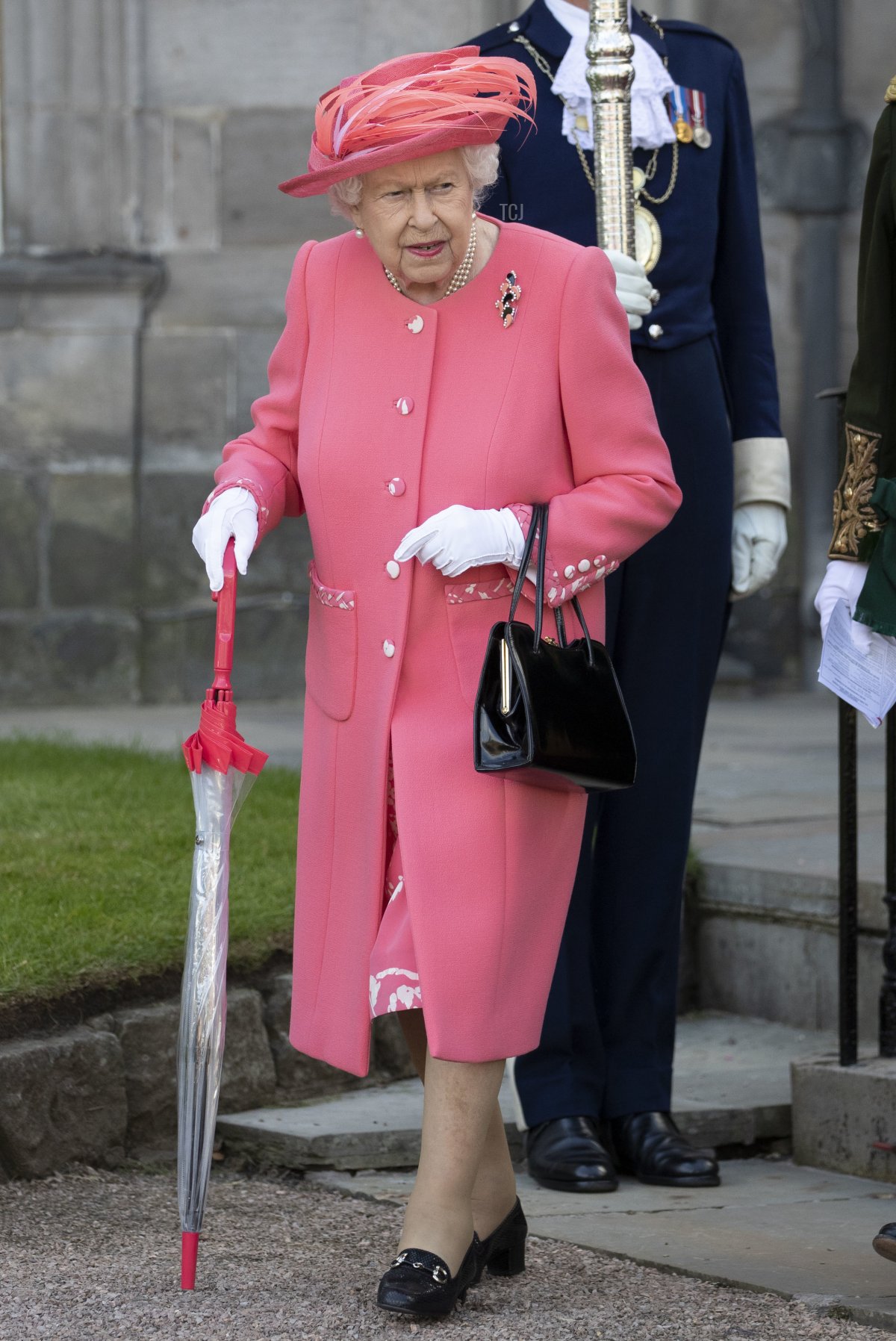 Britain's Queen Elizabeth II attends a garden party at the Palace of Holyroodhouse in Edinburgh on July 3, 2019