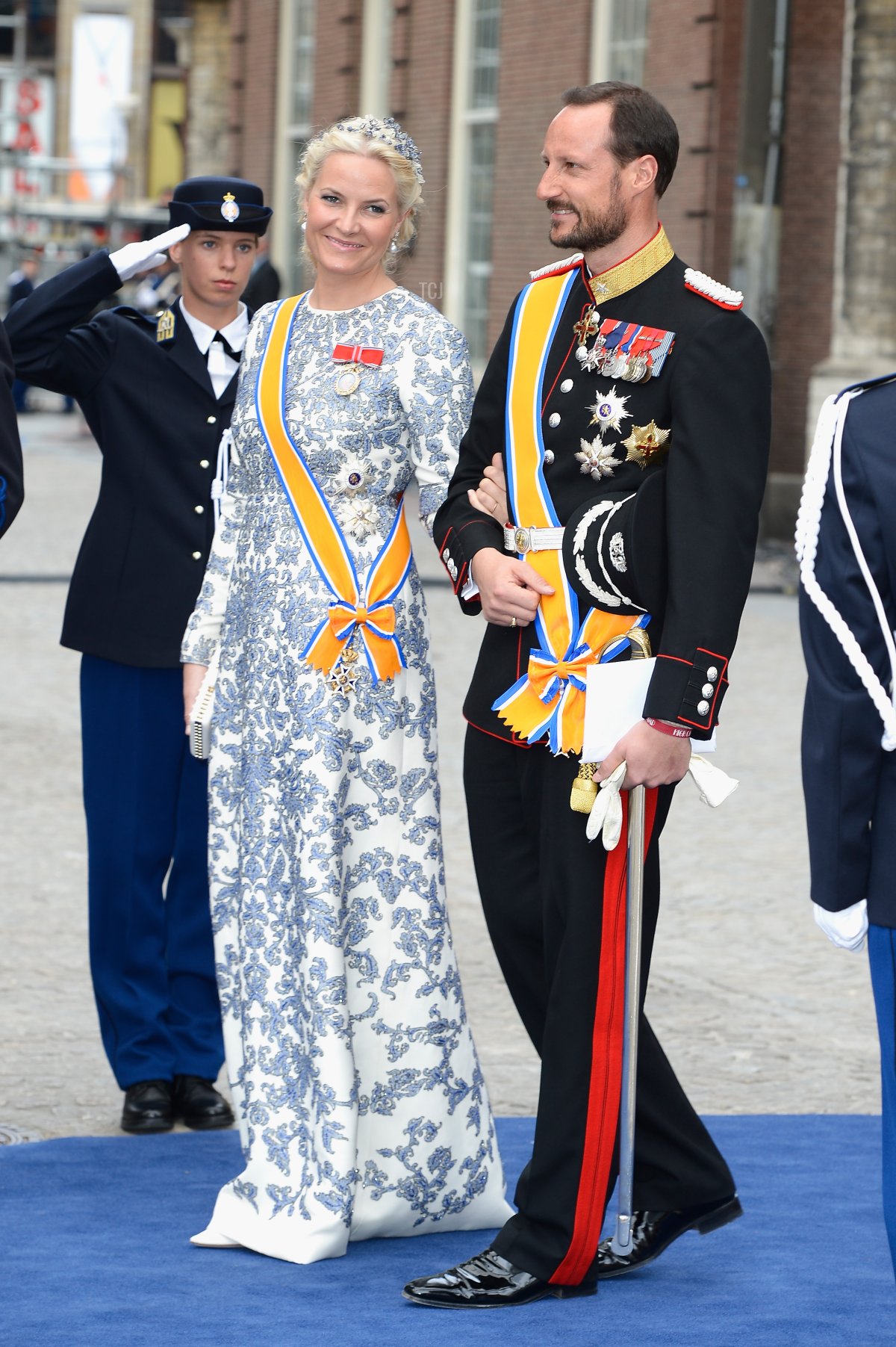 Crown Prince Haakon, and Crown Princess Mette-Marit of Norway depart the Nieuwe Kerk to return to the Royal Palace after the abdication of Queen Beatrix of the Netherlands and the Inauguration of King Willem Alexander of the Netherlands on April 30, 2013 in Amsterdam