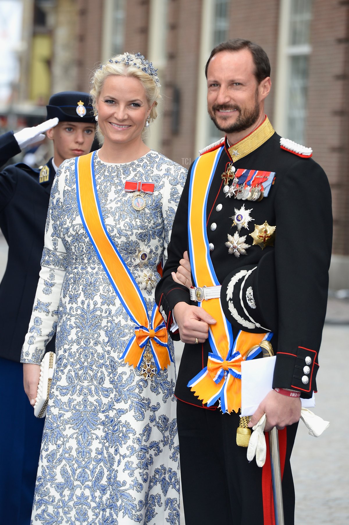 Crown Prince Haakon, and Crown Princess Mette-Marit of Norway depart the Nieuwe Kerk to return to the Royal Palace after the abdication of Queen Beatrix of the Netherlands and the Inauguration of King Willem Alexander of the Netherlands on April 30, 2013 in Amsterdam