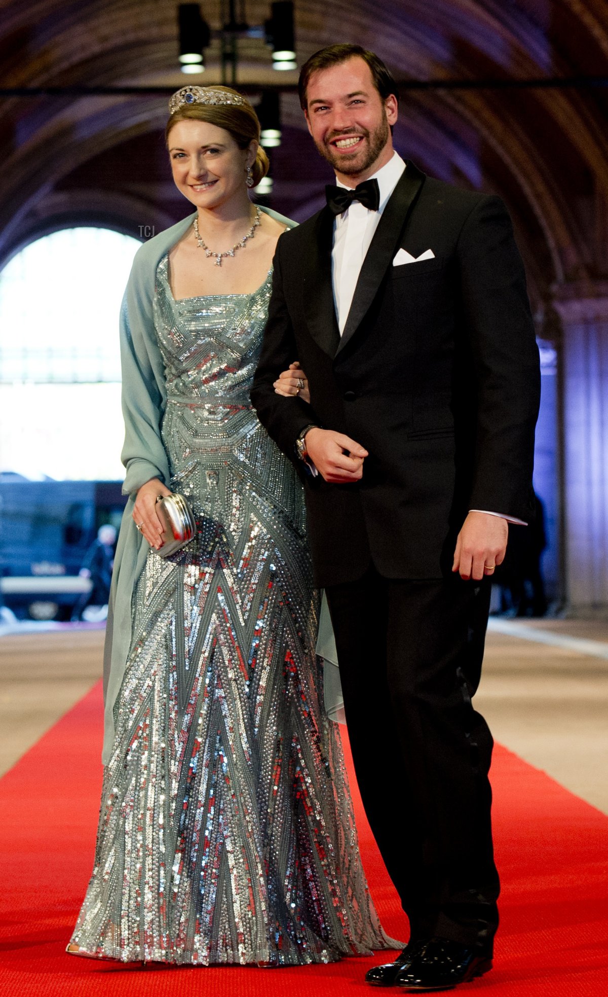 Luxembourg's Grand Duke Guillaume (R), his wife Grand Duchess Stephanie pose on April 29, 2013 as they arrive to attend a dinner at the National Museum (Rijksmuseum) in Amsterdam hosted by Queen Beatrix of the Netherlands on the eve of her abdication