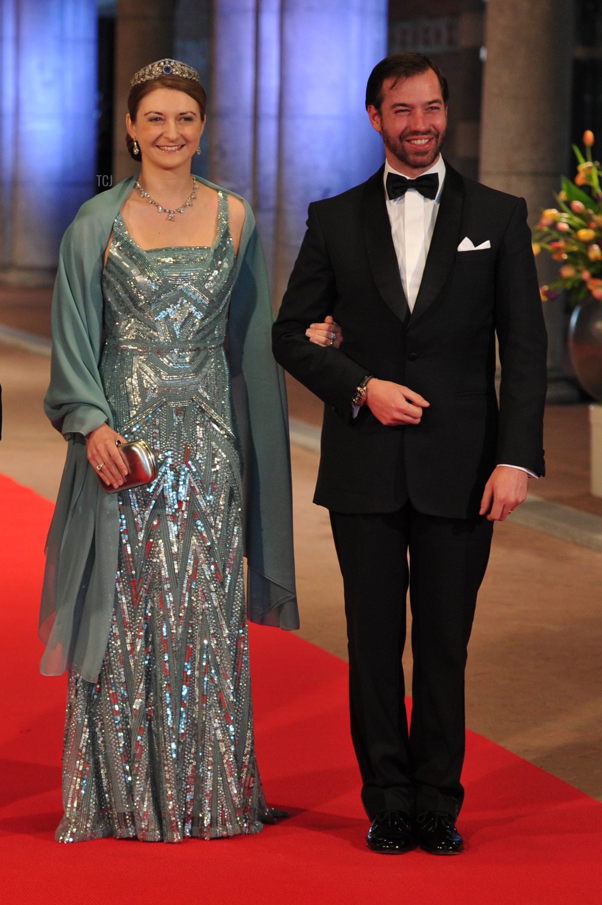 Luxembourg's Grand Duke Guillaume (R) and his wife Grand Duchess Stephanie pose on April 29, 2013 as they arrive to attend a dinner at the National Museum (Rijksmuseum) in Amsterdam hosted by Queen Beatrix of the Netherlands on the eve of her abdication