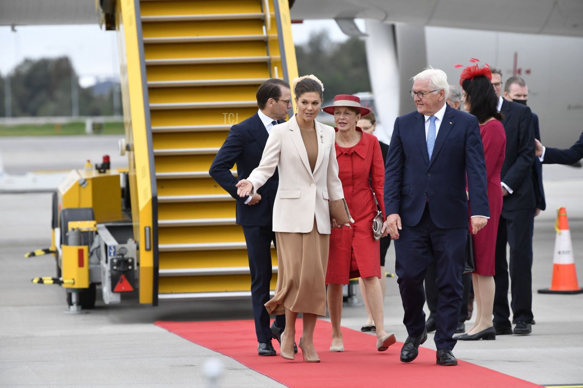German President Frank-Walter Steinmeier (R) and his wife wife Elke Buedenbender (2nd R) are received by Sweden's Crown Princess Victoria (2nd L) and Prince Daniel (L) at Arlanda airport outside Stockholm, on September 7, 2021