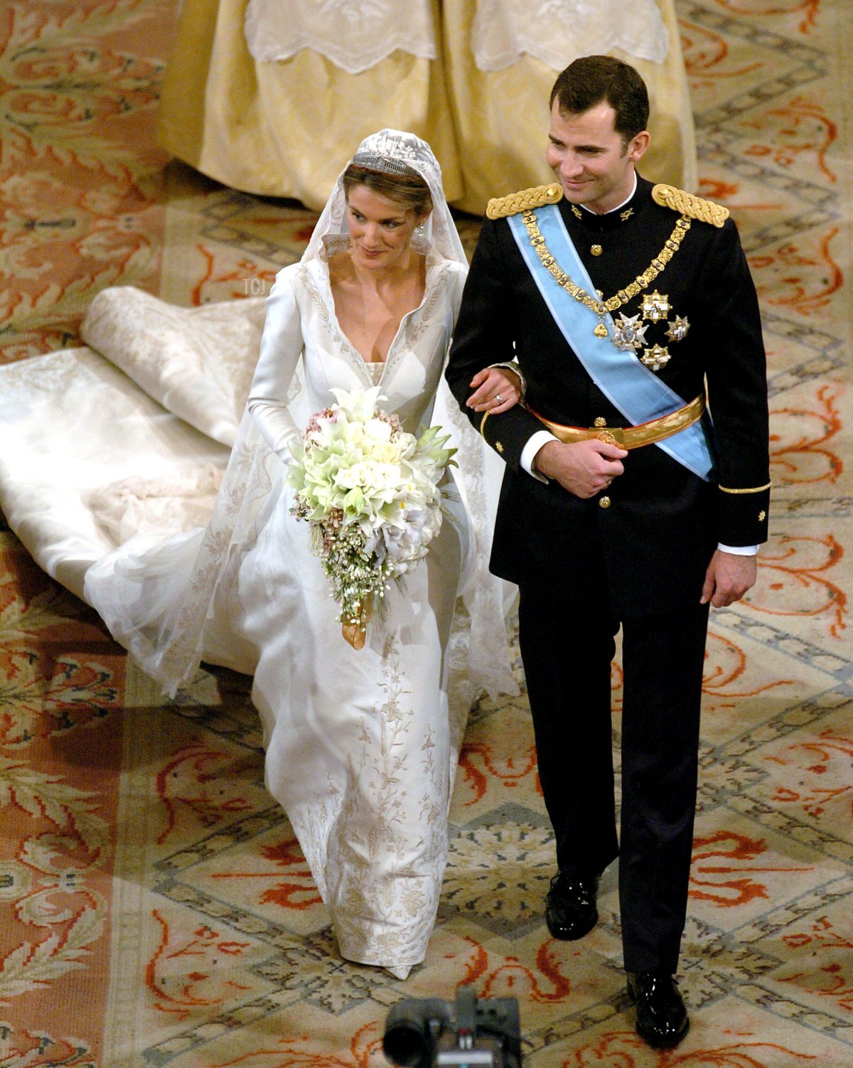 Spain's Crown Prince Felipe de Bourbon walks next to his bride Letizia Ortiz during their wedding ceremony in Almudena cathedral May 22, 2004 in Madrid