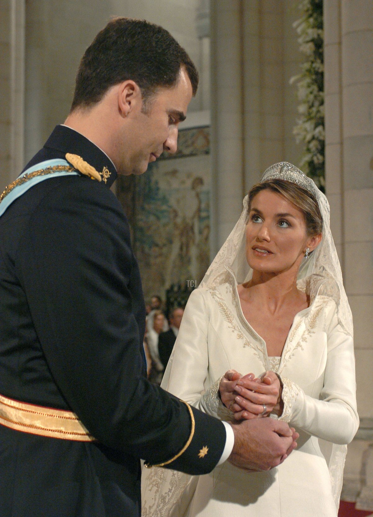 Spain's Crown Prince Felipe de Bourbon stands next to bride Letizia Ortiz as they marry in Almudena cathedral May 22, 2004 in Madrid